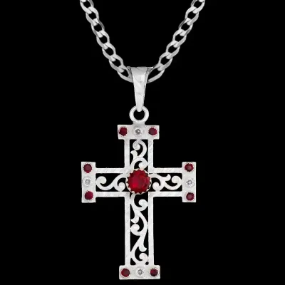 A custom silver cross pendant necklace for men and women, western-inspired design. featuring silver filigrane and red zirconia stones 